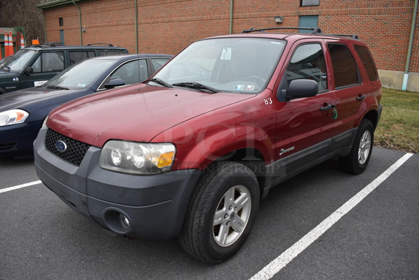 2005 Ford Escape Hybrid SUV. Odometer Reads 141,990. VIN 1FMYU96H75KD42741. Title In Hand. Vehicle Runs and Drives! See Lot #4 For Additional Pictures. This Item Needs To Be Removed On Pick Up Day: 2/10/21