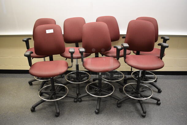 7 Maroon Office Chairs w/ Foot Rest Rail and Arm Rests on Casters. 24x20x48. 7 Times Your Bid! (John N. Hall Tech - Room 102)