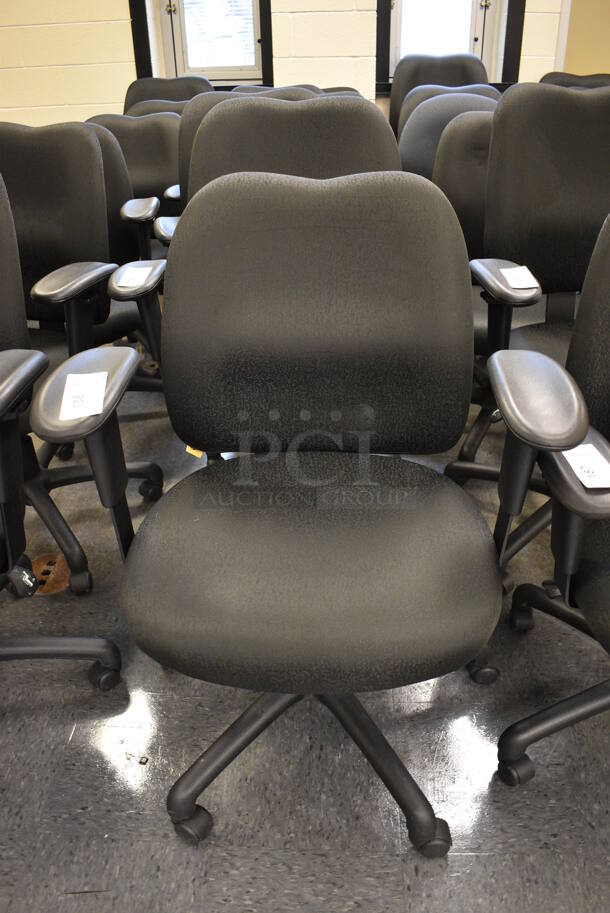 5 Black Office Chairs w/ Arm Rests on Casters. Stock Picture - Cosmetic Condition May Vary. 24x21x39. 5 Times Your Bid! (John N. Hall Tech - Room 104)