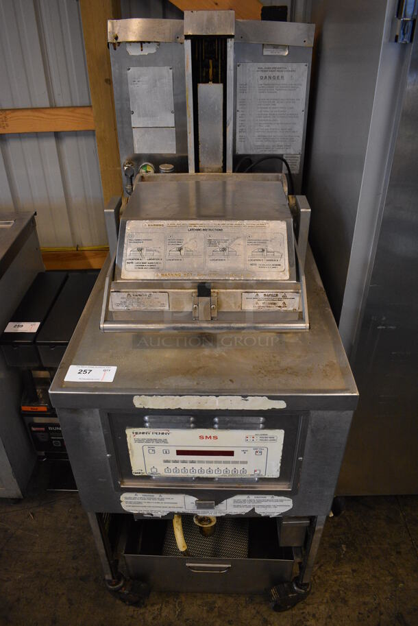 GORGEOUS! Henny Penny Model PFG-690 Stainless Steel Commercial Floor Style Natural Gas Powered Pressure Fryer w/ Filtration System on Commercial Casters. 100,000 BTU. 25x41x63