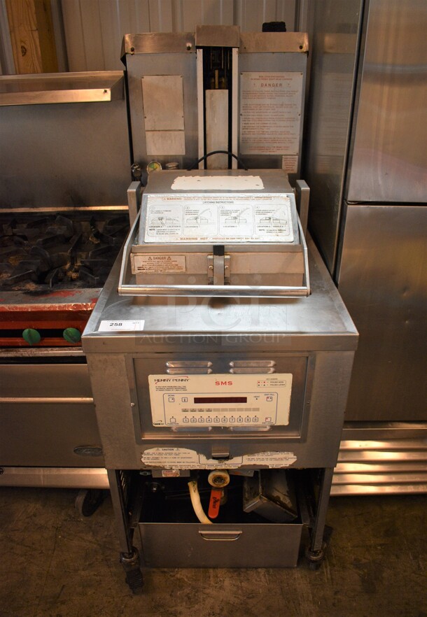 GORGEOUS! Henny Penny Model PFG-690 Stainless Steel Commercial Floor Style Natural Gas Powered Pressure Fryer w/ Filtration System on Commercial Casters. 100,000 BTU. 25x41x63
