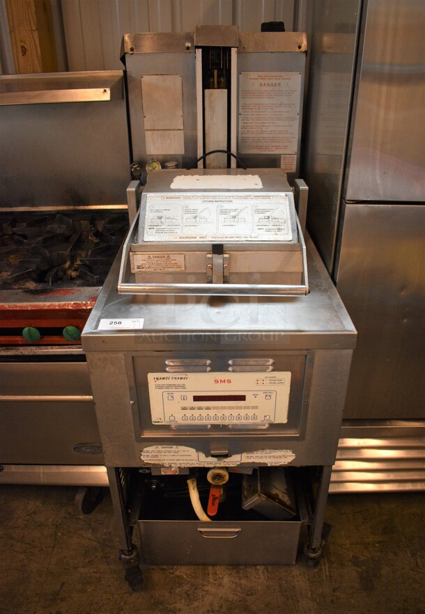 GORGEOUS! Henny Penny Model PFG-690 Stainless Steel Commercial Floor Style Natural Gas Powered Pressure Fryer w/ Filtration System on Commercial Casters. 100,000 BTU. 25x41x63 - Image 1 of 9
