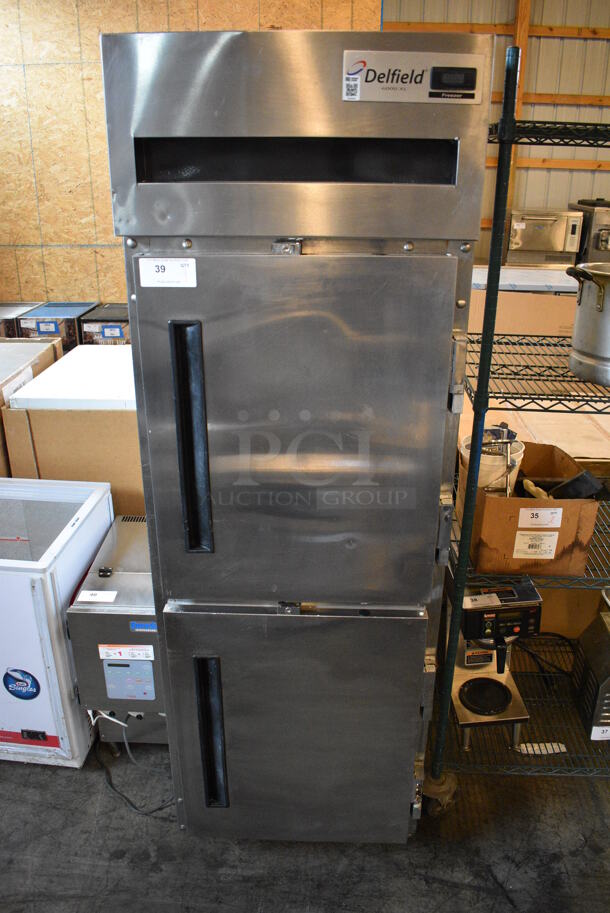 GREAT! Delfield 6000 XL Stainless Steel Commercial 2 Half Size Door Reach In Freezer w/ Poly Coated Racks on Commercial Casters. 26x32x80. Cannot Test - Unit Was Previously Hardwired