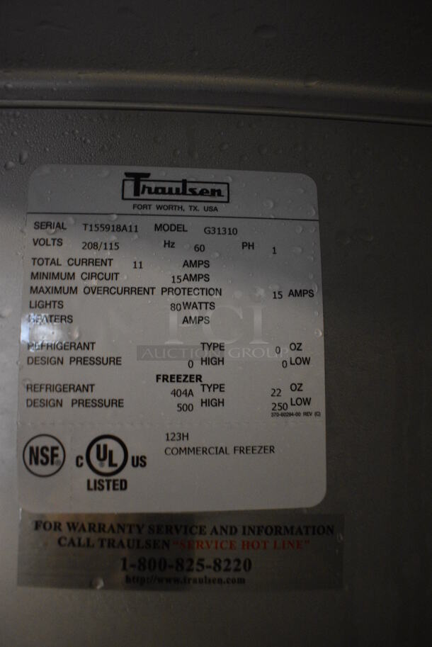 GREAT! Traulsen Model G31310 Stainless Steel Commercial 3 Door Reach In Freezer w/ Poly Coated Racks on Commercial Casters. 115/208 Volts, 1 Phase. 76x34x83 - Image 2 of 6