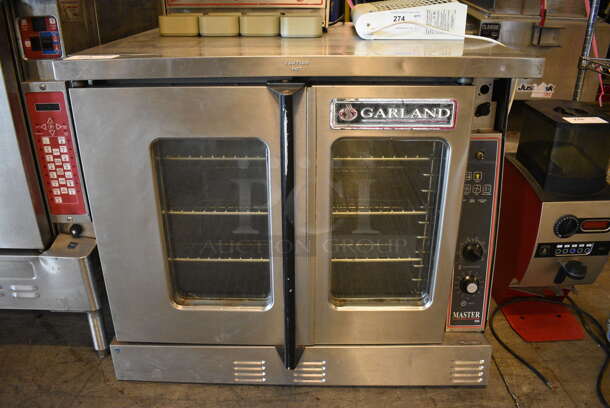 BEAUTIFUL! Garland Master 300 Stainless Steel Commercial Electric Powered Full Size Convection Oven w/ View Through Doors, Metal Oven Racks and Thermostatic Controls. 38x38x32