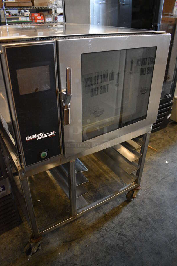BEAUTIFUL! 2012 Belshaw Adamatic Mono Model FG189T-UZ84 Stainless Steel Commercial Electric Powered Convection Oven w/ View Through Door and Stainless Steel Pan Rack on Commercial Casters. 208/220 Volts, 3 Phase. 33x44x48