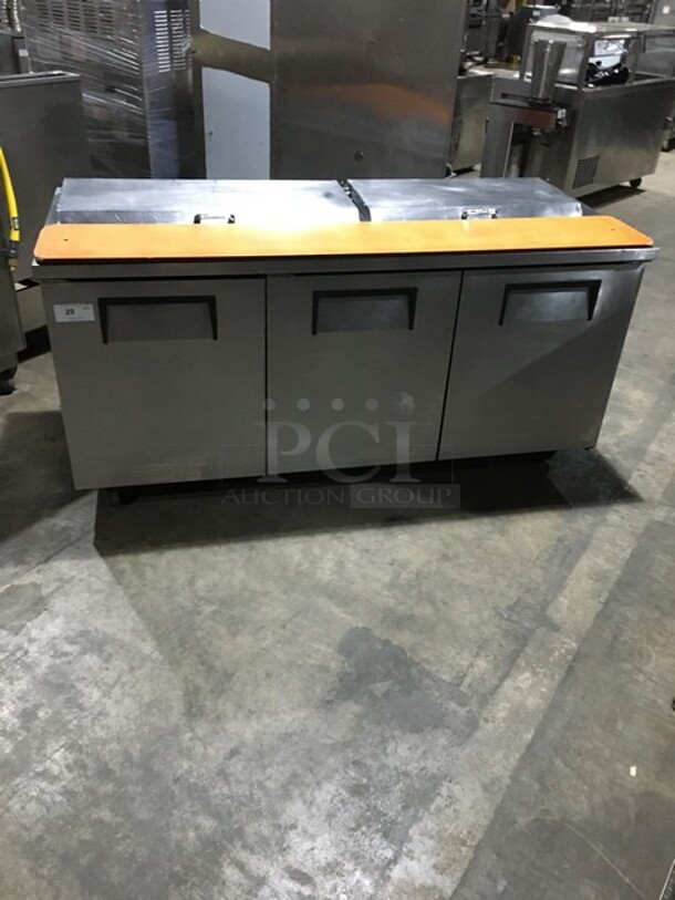 True Refrigerated 3 Door Stainless Steel Sandwich Prep Table! With Poly Coated Racks! With Wooden Cutting Board! Model TSSU7218 Serial 7296098! 115V 1Phase! On Commercial Casters! - Image 1 of 10