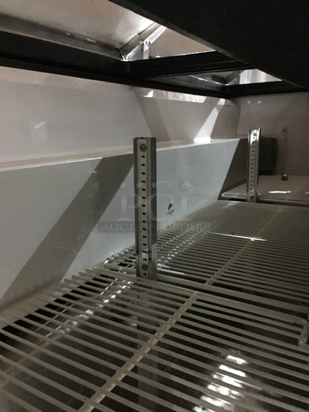 True Refrigerated 3 Door Stainless Steel Sandwich Prep Table! With Poly Coated Racks! With Wooden Cutting Board! Model TSSU7218 Serial 7296098! 115V 1Phase! On Commercial Casters! - Image 7 of 10