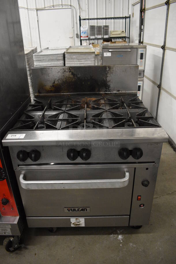 AWESOME! Vulcan Stainless Steel Commercial Floor Style Gas Powered 6 Burner Range w/ Oven and Backsplash on Commercial Casters. 36x34x48