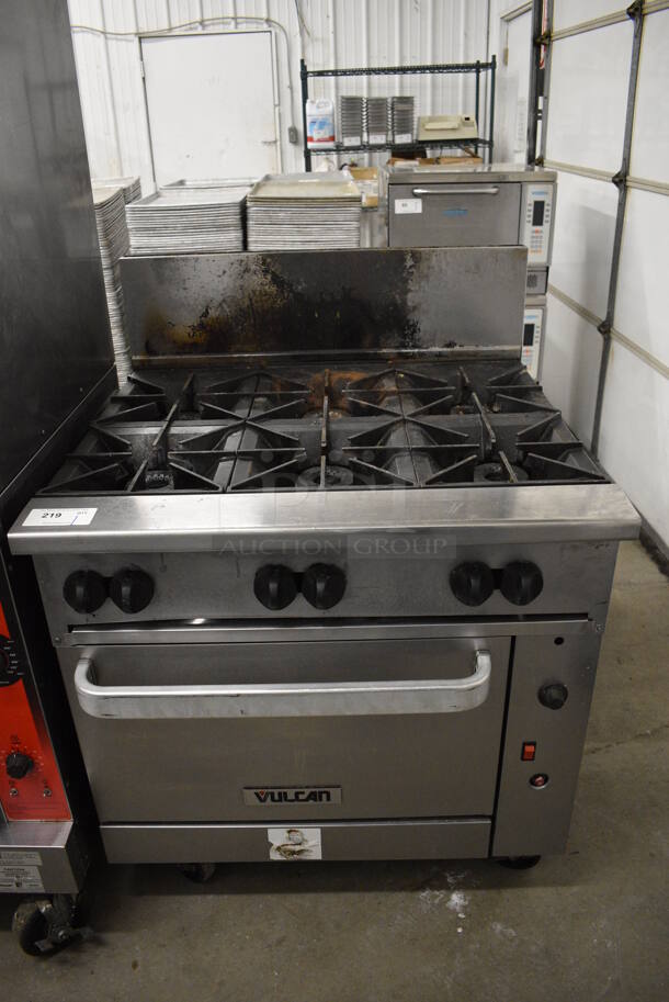 AWESOME! Vulcan Stainless Steel Commercial Floor Style Gas Powered 6 Burner Range w/ Oven and Backsplash on Commercial Casters. 36x34x48 - Image 1 of 8
