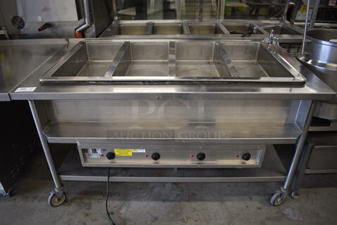 NICE! Atlas Metal Model WIH-D&M-47 Stainless Steel Commercial Floor Style Electric Powered 4 Well Steam Table w/ Undershelf on Commercial Casters. 208 Volts, 1 Phase. 66x37x37