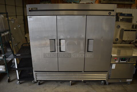 GREAT! 2016 True Model T-72 Stainless Steel Commercial 3 Door Reach In Cooler w/ Poly Coated Racks on Commercial Casters. 115 Volts, 1 Phase. 78x30x83. Tested and Working!