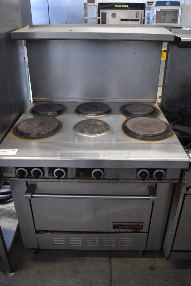 GREAT! Garland Stainless Steel Commercial Electric Powered 6 Burner Range w/ Oven, Overshelf and Backsplash on Commercial Casters. 36x34.5x57