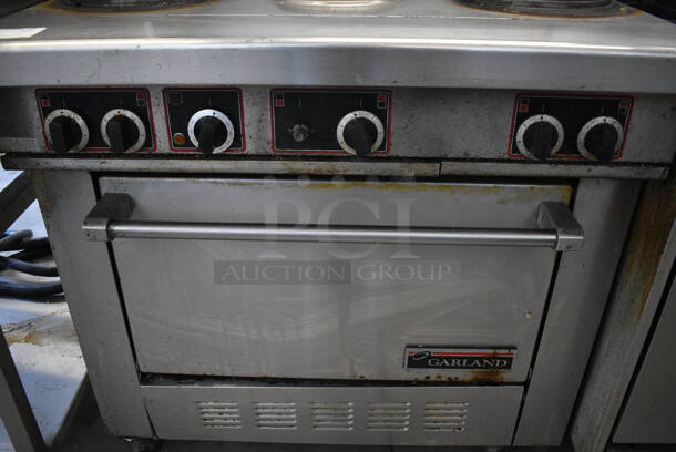 GREAT! Garland Stainless Steel Commercial Electric Powered 6 Burner Range w/ Oven, Overshelf and Backsplash on Commercial Casters. 36x34.5x57 - Image 2 of 6