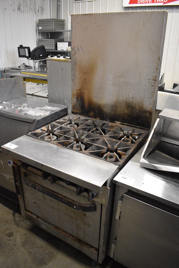 GREAT! Southbend Stainless Steel Commercial Gas Powered 6 Burner Range w/ Oven and Backsplash on Commercial Casters. 32x38x72