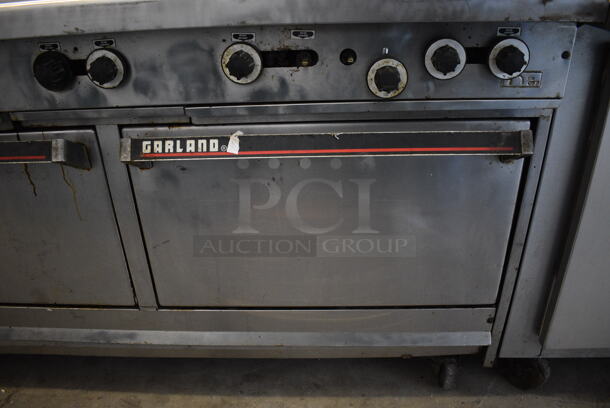 GREAT! Garland Stainless Steel Commercial Gas Powered 10 Burner Range w/ 2 Ovens and Backsplash on Commercial Casters. 60x34x56 - Image 5 of 9