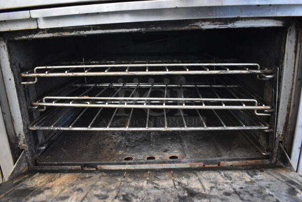 GREAT! Garland Stainless Steel Commercial Gas Powered 10 Burner Range w/ 2 Ovens and Backsplash on Commercial Casters. 60x34x56 - Image 8 of 9