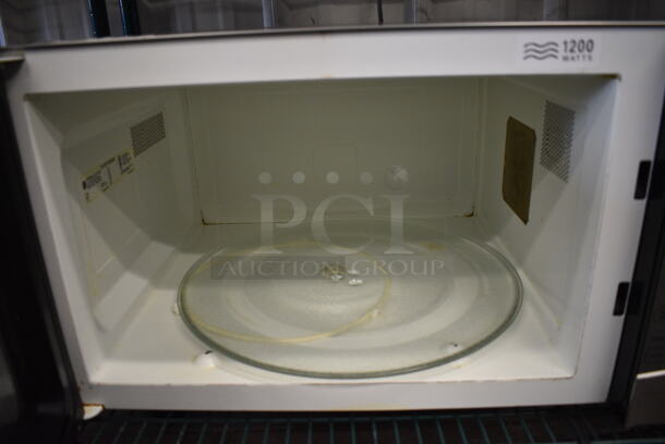 General Electric Chrome Finish Countertop Microwave Oven w/ Plate. 24x18x14 - Image 4 of 5