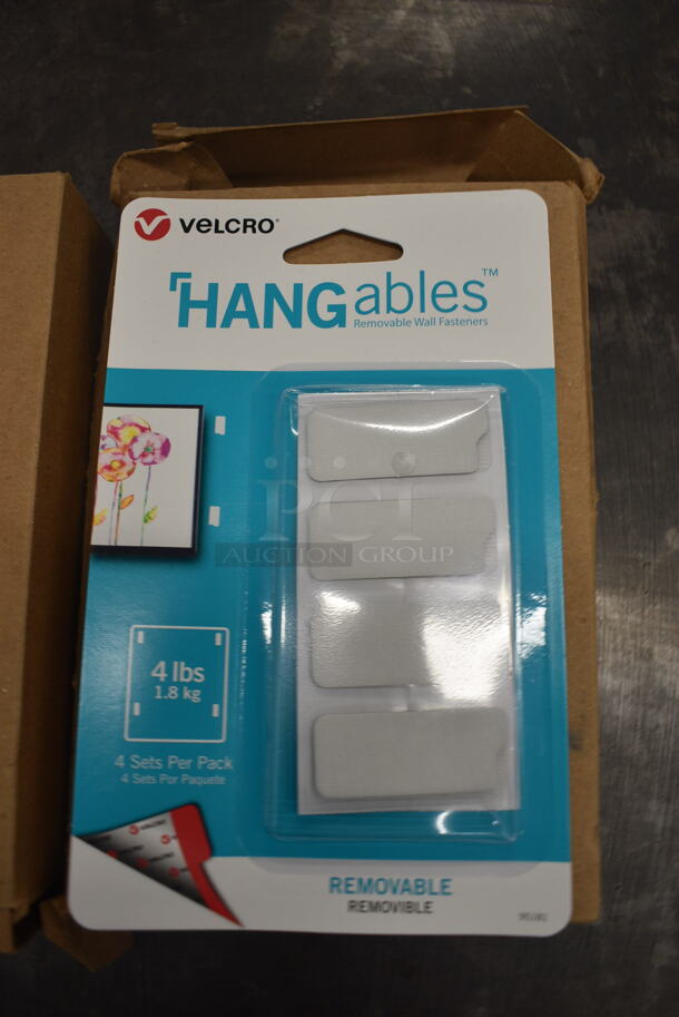 12 BRAND NEW IN BOX! Hangables Velcro Wall Fasteners. 12 Times Your Bid!