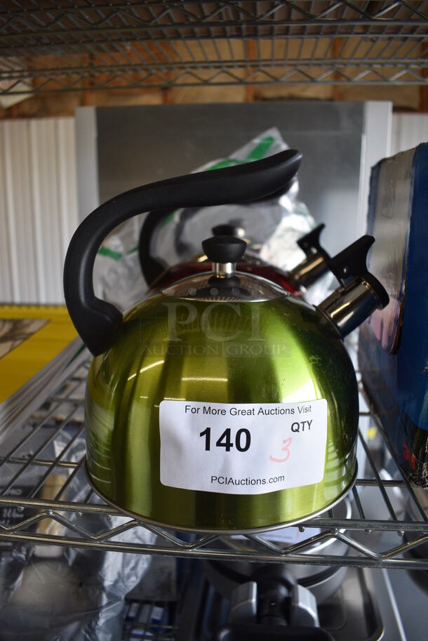 3 BRAND NEW! Metal Tea Kettles; 1 Green and 2 Red. 8x8x8.5. 3 Times Your Bid! - Image 1 of 3