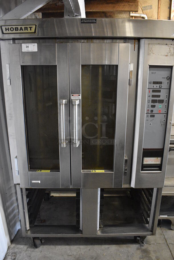 GORGEOUS! Hobart Stainless Steel Commercial Electric Powered Mini Rotating Rack Oven w/ Lower Double Pan Rack on Commercial Casters. 208/240/480 Volt, 3 Phase. 48x35x75 - Image 1 of 9