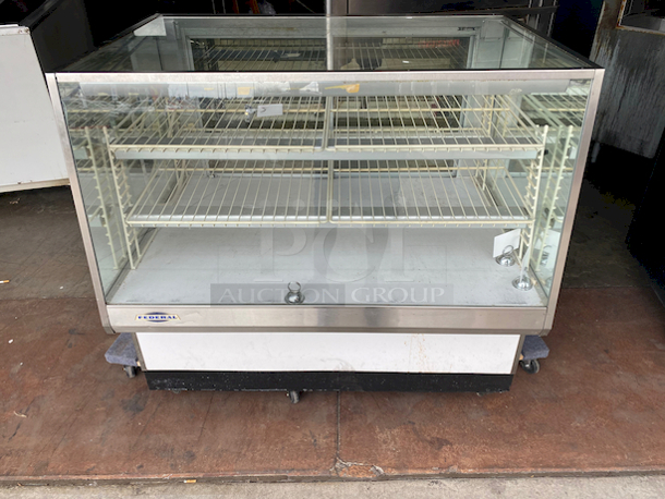 SWEET! Federal industries Model VL-48 Lighted Bakery Display Case. 120v, 60hz, 1ph 2amps. 
Tested. Lights are Working. 

Features:

Four Shelves (Two Tiers)
Three Interior Lights
Mirrored Sides
Smoked Glass Rear Doors
Sliding Rear Doors
Glass Top and Front
