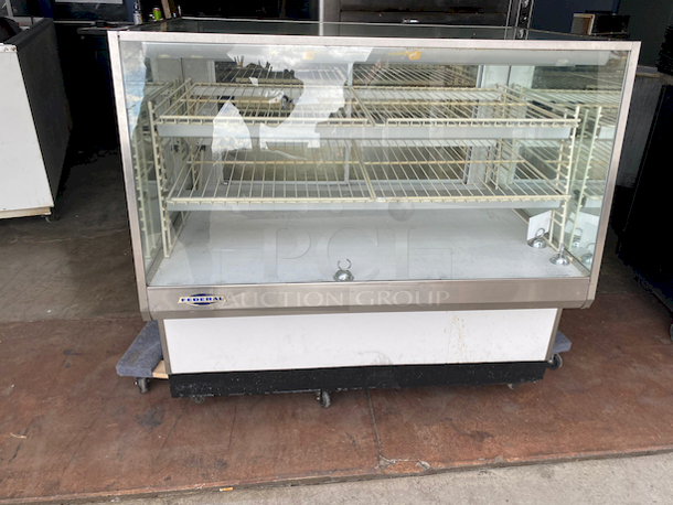 SWEET! Federal industries Model VL-48 Lighted Bakery Display Case. 120v, 60hz, 1ph 2amps. 
Tested. Lights are Working. 

Features:

Four Shelves (Two Tiers)
Three Interior Lights
Mirrored Sides
Smoked Glass Rear Doors
Sliding Rear Doors
Glass Top and Front - Image 2 of 8