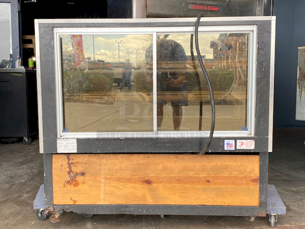 SWEET! Federal industries Model VL-48 Lighted Bakery Display Case. 120v, 60hz, 1ph 2amps. 
Tested. Lights are Working. 

Features:

Four Shelves (Two Tiers)
Three Interior Lights
Mirrored Sides
Smoked Glass Rear Doors
Sliding Rear Doors
Glass Top and Front - Image 4 of 8