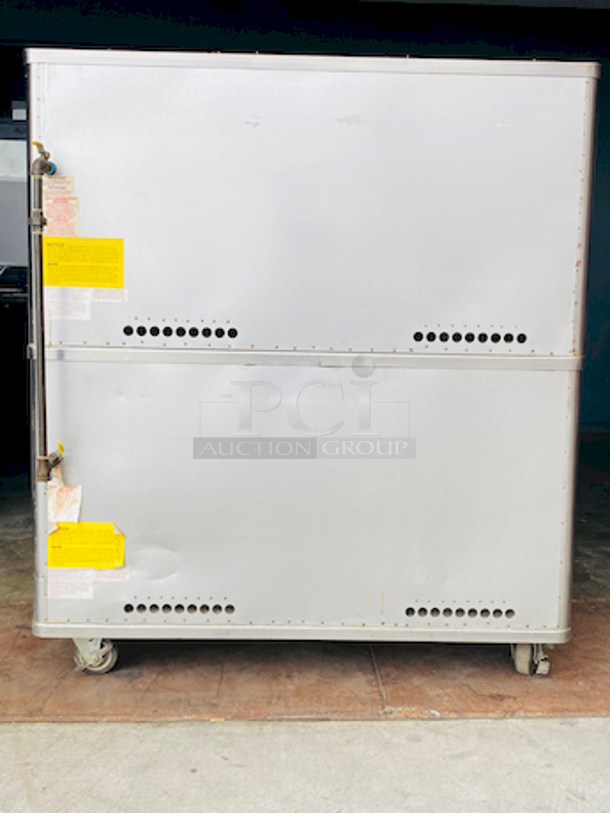 PRISTINE!! Blodgett 981 Natural Gas Multi-Purpose Double Deck Oven with Draft Diverter - 100,000 BTU. On Commercial Casters.    Can be used for: roasts, pastries, cakes, artesian breads, pizzas, and more 42"W x 32"D deck interior, (4) sections, consists of (4) 7" high baking compartments per section, (FTDO) 200-500°F mechanical thermostat, counter-balanced doors with heavy chrome handle, angle iron frame, steel deck, crown angle trim, aluminized steel interior, stainless steel top, front, sides and back  Overall Dimensions: Width: 60" Depth: 38 1/2" Height: 68 13/16" Interior Dimensions (Per Oven): Width: 42" Depth: 32" Height: 7" Deck Thickness: 1" - Image 3 of 11