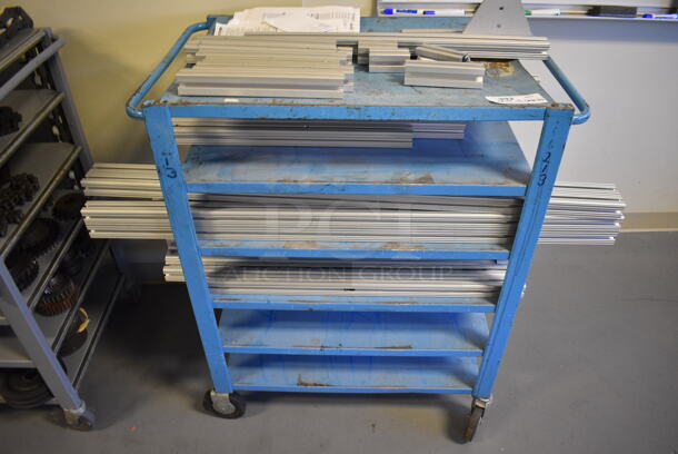 Metal Cart w/ Contents on Commercial Casters. 34x22x40. (Midtown 2: Room 130)