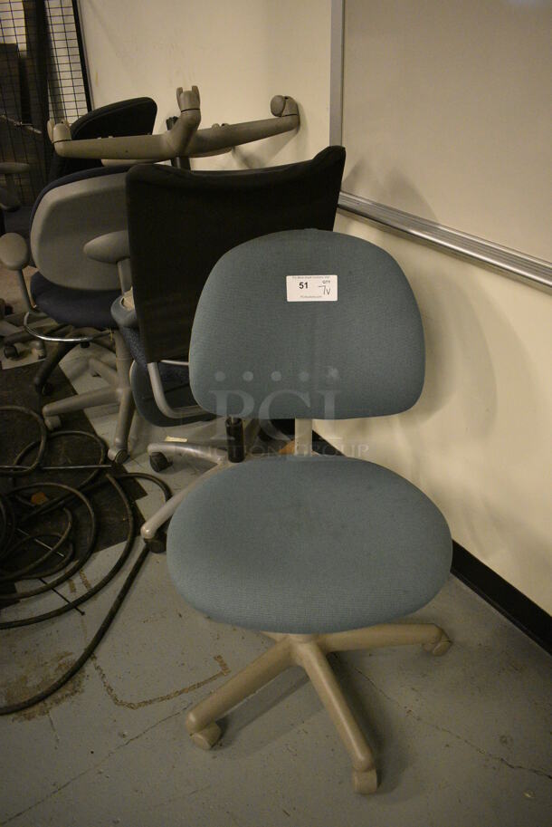 7 Various Office Chairs on Casters. Includes 21x22x37. 7 Times Your Bid! (Midtown 1: Room 122)