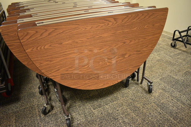 4 Wood Pattern Round Fold Up Tables on Commercial Casters. Makes a 60x60 Table. 60x18x39. 4 Times Your Bid! (Midtown 2: Second Floor: Room 206D) - Image 2 of 5