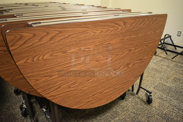 4 Wood Pattern Round Fold Up Tables on Commercial Casters. Makes a 60x60 Table. 60x18x39. 4 Times Your Bid! (Midtown 2: Second Floor: Room 206D) - Image 3 of 5