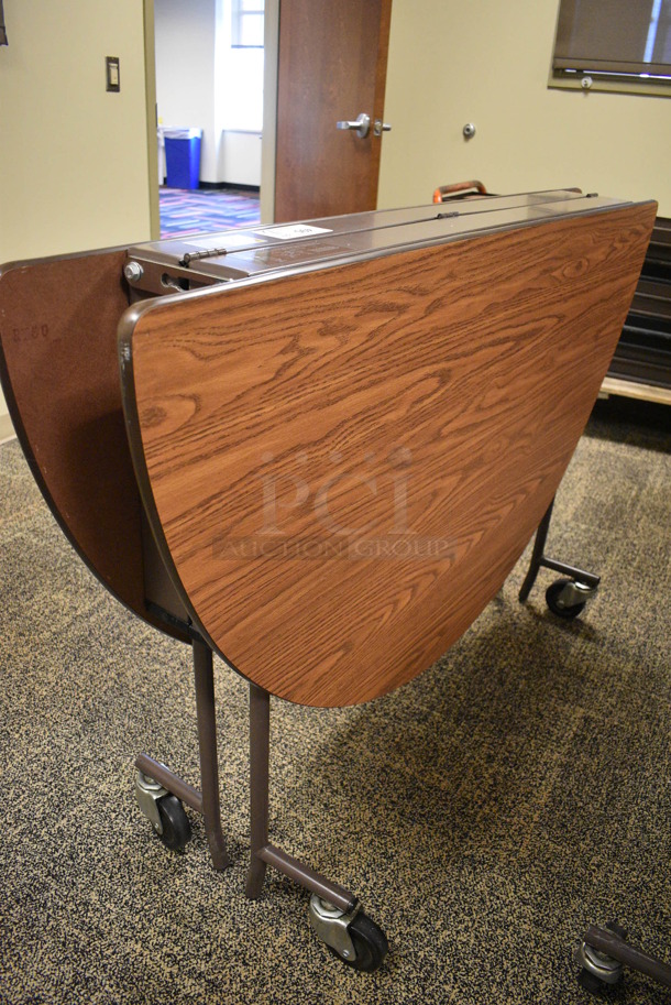 4 Wood Pattern Round Fold Up Tables on Commercial Casters. Makes a 60x60 Table. 60x18x39. 4 Times Your Bid! (Midtown 2: Second Floor: Room 206D) - Image 5 of 5