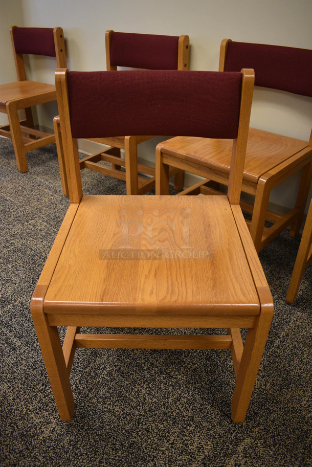 6 Wooden Chairs w/ Maroon Backrest. Stock Pictures Used. 19x18x32. 6 Times Your Bid! (Midtown 2: Second Floor: Room 212)