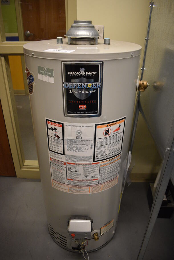 Bradford White Model MI403S6FBN Metal Floor Style Natural Gas Powered Automatic Storage Water Heater. 40,000 BTU. 22x22x50. Unit Will Be Unhooked and Removed Before Pick Up Day. (Midtown 2: Room 130)