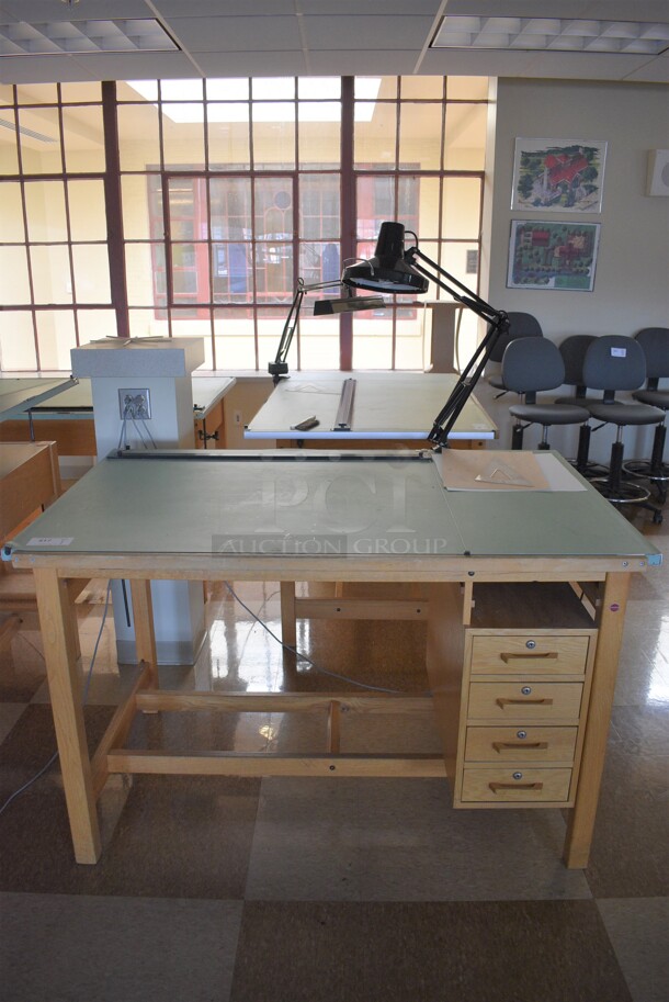 Wooden Drafting Table w/ 4 Drawers and Attached Metal Light. 60x40x68. Table: 60x39x37.5. (Midtown 2: Second Floor: Room 216)