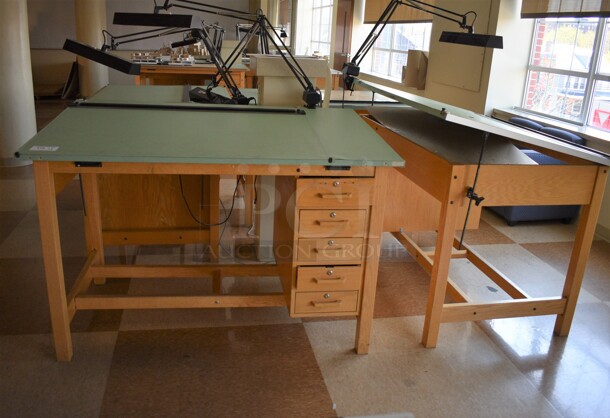 4 Wooden Drafting Table w/ 5 Drawers and Attached Metal Light. 60x40x68. Table: 60x39x37.5. 4 Times Your Bid! (Midtown 2: Second Floor: Room 216)
