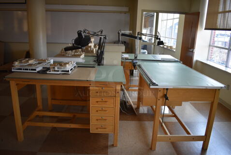 4 Wooden Drafting Table w/ 5 Drawers and Attached Metal Light. 60x40x68. Table: 60x39x37.5. 4 Times Your Bid! (Midtown 2: Second Floor: Room 216)