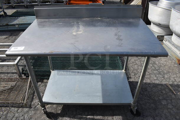 Stainless Steel Commercial Table w/ Backsplash and Undershelf on Commercial Casters. 48x30x42