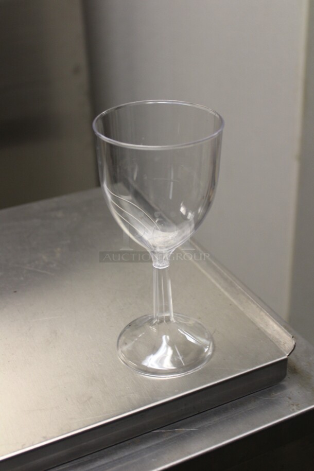 ALL ONE MONEY! Box Of Plastic Wine Glasses.  - Image 1 of 2