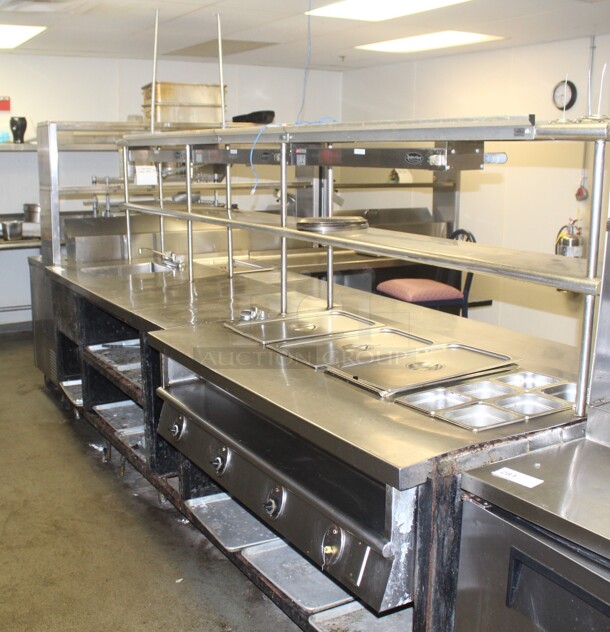 HUGE! Commercial Stainless Steel L-Shaped Food Warming/Prep Tables With Shelves. 135x122x66. Working When Closed! Buyer Must Disassemble Remove. Please See All Photos As This Is A Very Large Item. 