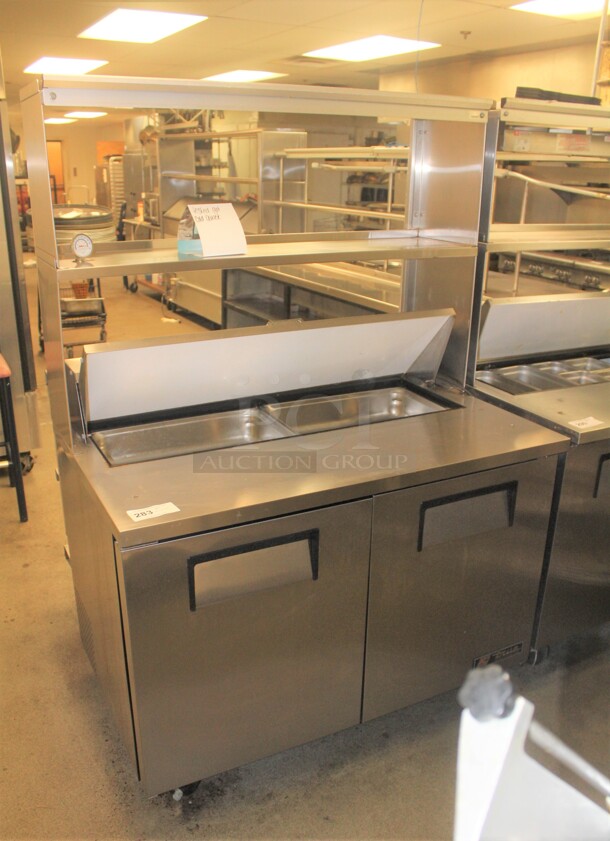 FANTASTIC! True Model TSSU-48-12 Commercial Stainless Steel Sandwich/Salad Refrigerated Prep Table On Commercial Casters With Shelves. 48x31x69. 115V/60Hz. Working When Closed! Buyer Must Remove. 