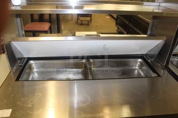 FANTASTIC! True Model TSSU-48-12 Commercial Stainless Steel Sandwich/Salad Refrigerated Prep Table On Commercial Casters With Shelves. 48x31x69. 115V/60Hz. Working When Closed! Buyer Must Remove.  - Image 2 of 6