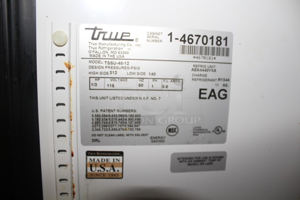 FANTASTIC! True Model TSSU-48-12 Commercial Stainless Steel Sandwich/Salad Refrigerated Prep Table On Commercial Casters With Shelves. 48x31x69. 115V/60Hz. Working When Closed! Buyer Must Remove.  - Image 3 of 6