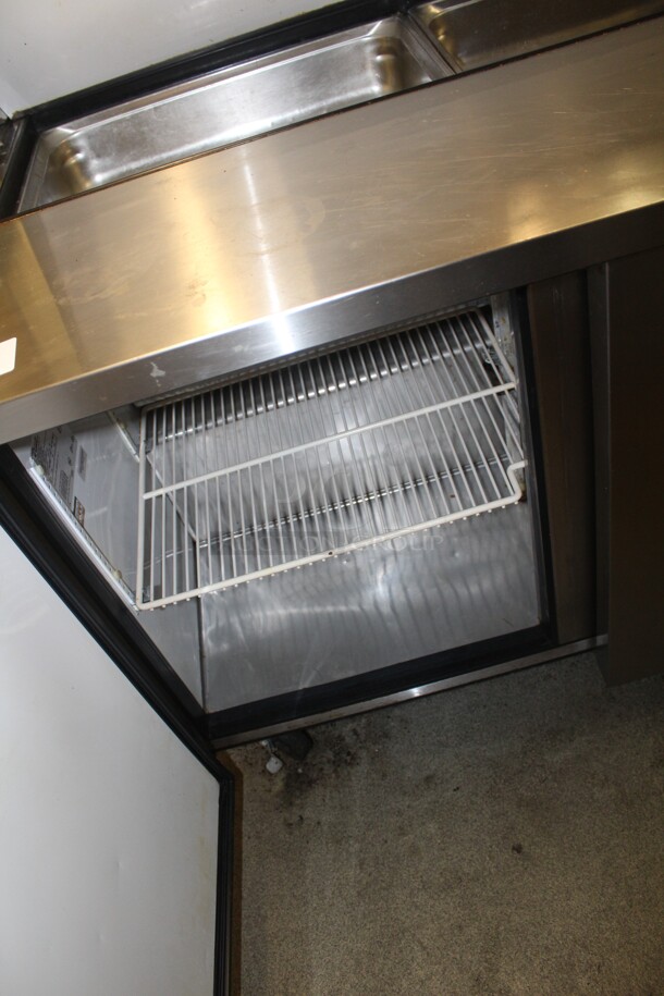 FANTASTIC! True Model TSSU-48-12 Commercial Stainless Steel Sandwich/Salad Refrigerated Prep Table On Commercial Casters With Shelves. 48x31x69. 115V/60Hz. Working When Closed! Buyer Must Remove.  - Image 4 of 6