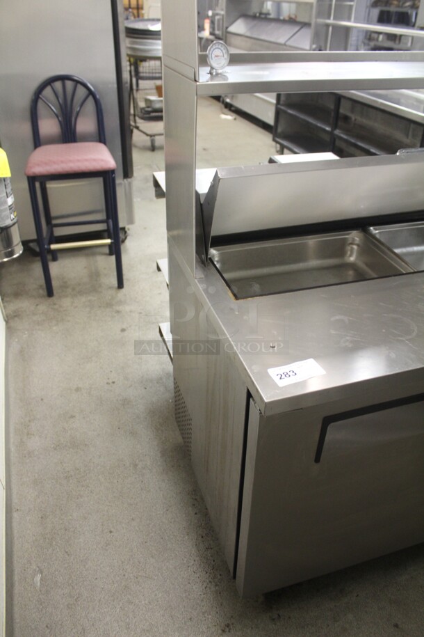 FANTASTIC! True Model TSSU-48-12 Commercial Stainless Steel Sandwich/Salad Refrigerated Prep Table On Commercial Casters With Shelves. 48x31x69. 115V/60Hz. Working When Closed! Buyer Must Remove.  - Image 6 of 6