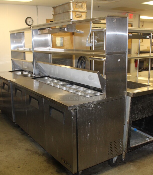 AWESOME! True Model TSSU-72-18 Commercial Stainless Steel Sandwich/Salad Prep Table On Commercial Casters With Shelves And Superior Model FD-36 Overhead Warmer. 72x31x49. 115V/60Hz. Working When Closed! Buyer Must Remove.  - Image 1 of 9