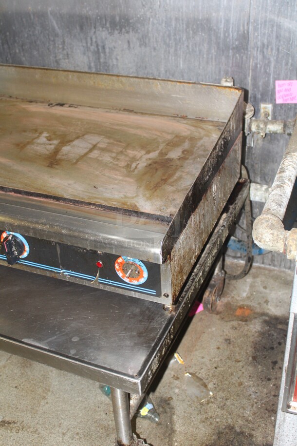GREAT! Superior Commercial Stainless Steel Natural Gas Griddle On Equipment Stand On Casters. 49x36x33. Working When Closed! Buyer Must Remove.  - Image 3 of 4