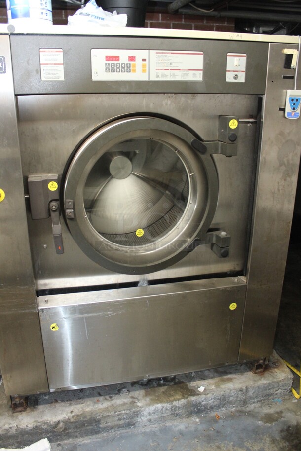 GREAT! Continental Girbau Model H2090PM21010 Commercial Stainless Steel Front Loading Washing Machine. 54x54x67. 208-240V/60Hz. 3 Phase. Per Owner, Takes A Few Times To Start But Does Wash. Buyer Must Remove.  - Image 1 of 5